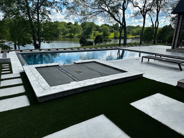 Modern rectangular inground pool and stunning landscape